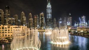 A vibrant night view of Dubai's skyline, showcasing the city's dynamic growth and a promising year for real estate investments.